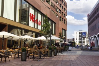 Street café with lettering, passers-by, subway station, Westfield Überseequartier, modern shopping