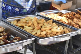 Fresh fried Thai spring rolls street food in chafing dish
