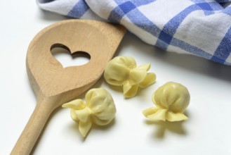 Saccottini, type of Italian pasta and cooking spoon with heart, pasta from Italy