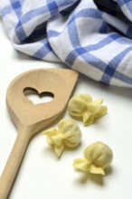 Saccottini, type of Italian pasta and cooking spoon with heart, pasta from Italy