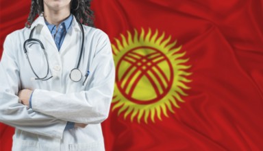 Medical professional on Kyrgyzstan flag. Healthcare and wellness in Kyrgyzstan, Concept
