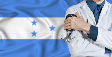 Honduran healthcare concept. Doctor with stethoscope on Honduras flag. Doctor holding stethoscope