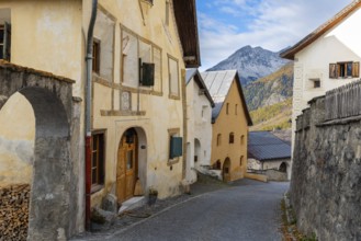 Engadin houses with sgraffiti, historic houses, village street with stones, Guarda, Engadin,