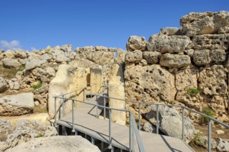 View from secured walkway with railing through ruins remains of Ggantija temple, UNESCO World