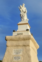 Christian religious statue of Madonna Mary Mother of God on Ramla Bay beach, Gozo island, Malta