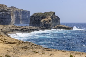 Rough rough sea surf during autumn storm high rugged cliffs burn on beach coast on the