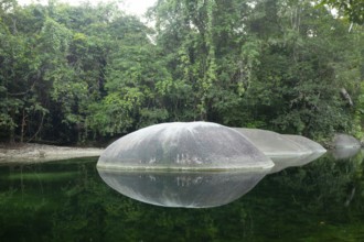 Turquoise blue water between rocks in the tropical rainforest of Babinda Boulders Queensland,