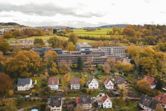 Panoramic view of a small town in an autumnal landscape with surrounding fields, Calw District