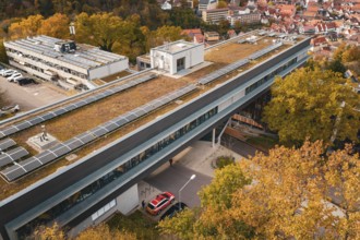 Building with solar technology on the roof, surrounded by autumn surroundings, Calw District