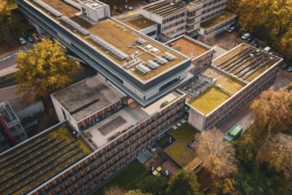 Modern architecture with green roofs and solar cells, nestled in an autumn environment, Calw