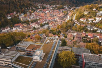 City view with various buildings, river and autumn trees from above, Calw District Office, Calw,