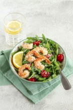Shrimp salad with arugula and cherry tomatoes, with parmesan cheese, healthy food