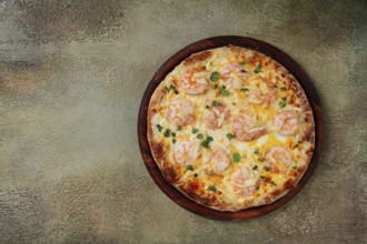 Four cheese pizza with shrimp and fresh microgreens, served on a wooden board, homemade, no people