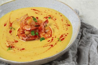 Pumpkin cream soup with shrimp, herbs and spices, homemade, no people