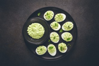 Snack, stuffed eggs with avocado, homemade, no people