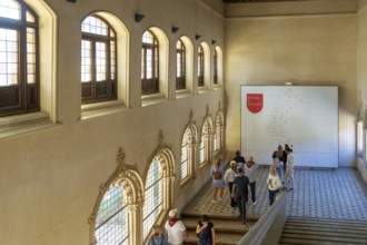 Visitors viewing wall chart of genealogy of Kings of Aragon, Aljafería Palace, Zaragoza, Aragon,