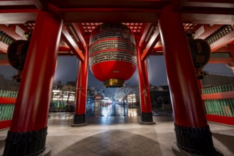 Huge red lantern in the illuminated thunder gate Kaminarimon of Asakusa Shrine or Senso-ji Temple,