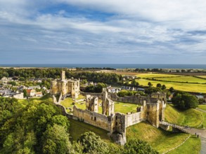 Warkworth Castle over River Coquet from a drone, Warkworth, Northumberland, England, United Kingdom