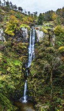Autumn colours over Pistyll Rhaeadr Waterfall and Berwyn Mountains from a drone, Oswestry,