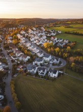 Aerial view of a village in autumn landscape at sunset, Deufringen, Aidlingen, Böblingen district,
