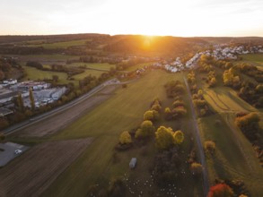 Wide fields with a village in warm autumn light at sunset, Deufringen, Aidlingen, Böblingen