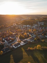 Aerial view of a village in autumn with warm sunset light, Deufringen, Aidlingen, Böblingen