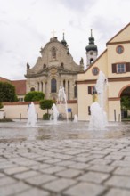 Historic church with fountain in the foreground, baroque architecture and cobblestones, ZFP