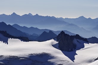 View of the snow-capped mountains from the Aiguille du Midi mountain station observation deck,
