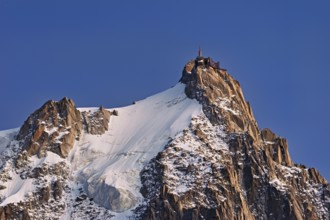 Snowy Aiguille du Midi in the evening light, Mont-Blanc, Chamonix-Mont-Blanc, Haute-Savoie, France