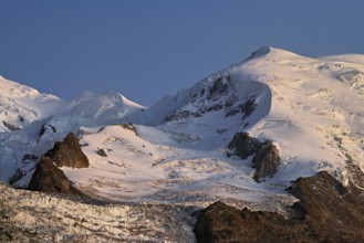 Snow-covered Dome du Goûter, in the evening light, Chamonix-Mont-Blanc, Haute-Savoie, France