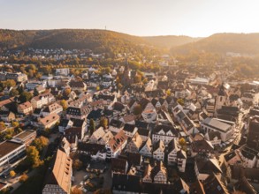 Panorama of a city in autumn with churches and diverse architecture from the air, Nagold, Black