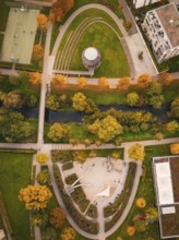 Viaduct leads through an urban area with houses and autumn trees, near a skate park, Nagold, Black