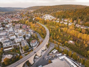 Aerial view of a modern residential area with a park-like area and colorful autumn leaves, Nagold,