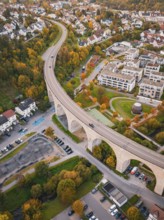 Viaduct runs through a small town surrounded by forests in autumn colors, Nagold, Black Forest,