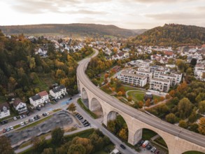 Urban landscape with bridge and autumn trees in the golden hour, Nagold, Black Forest, Germany