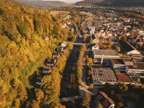 Aerial view of a city along a river in autumn, Nagold, Black Forest, Germany