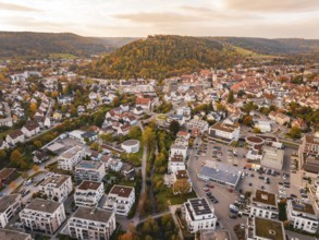 Aerial view of a city with surrounding hills and autumnal atmosphere, Nagold, Black Forest, Germany