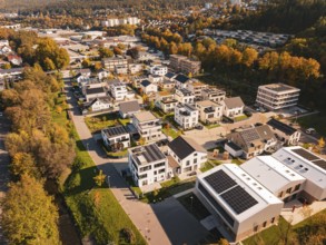 Modern residential buildings with solar panels in autumn surroundings, Nagold, Black Forest,