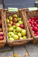 Baskets with various types of apples on display at a market, Streuobstmarkt, Sindelfingen,