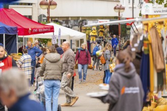 People stroll and talk at a busy market with many stalls, traditional fruit market, Sindelfingen,
