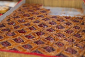 Large raspberry cake with grid pattern presented on a tray, Streuobstmarkt, Sindelfingen, Böblingen