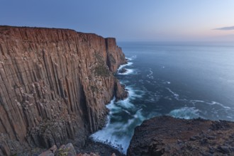 At The Gap, long exposure shows sunset over the cliffs of Cape Raoul. Golden light hits the sea and
