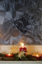 Christmassy decorated iced window, candle light, straw stars, Germany