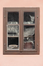 Pink house facade, window with old objects, Kranj, Upper Carniola, Slovenia