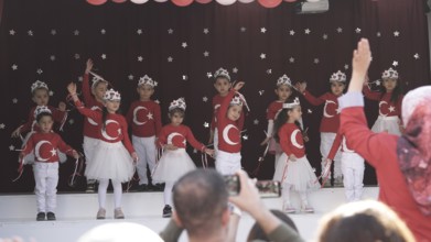 Children celebrate the 102nd anniversary of the Republic Day of Turkey, a national holiday