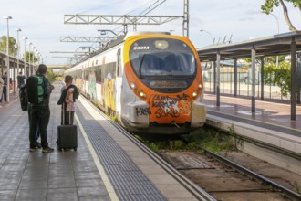 Renfe Civia commuter train at platform of Airport railway station, Rodalia de Barcelona suburban