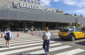 Taxis in street outside Barcelona-Sants railway station building in city centre, Barcelona,