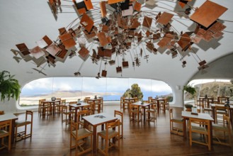 Interior of café with panoramic window in building designed by Cesar Manrique with the