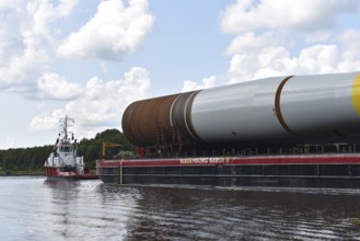 Tugboat, tow ship pulls parts of a wind turbine, offshore, in the Kiel Canal, NOK, Kiel Canal,