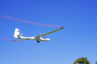An SZD-59-1 ACRO glider, registration D-1138, during a demonstration as part of an air show at the